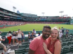 Madison and Ivan enjoy a Red Sox game at Fenway Park while living in Boston, Massachusetts.